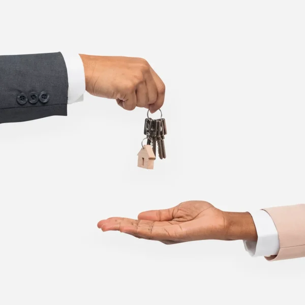 hand-giving-key-real-estate-agent